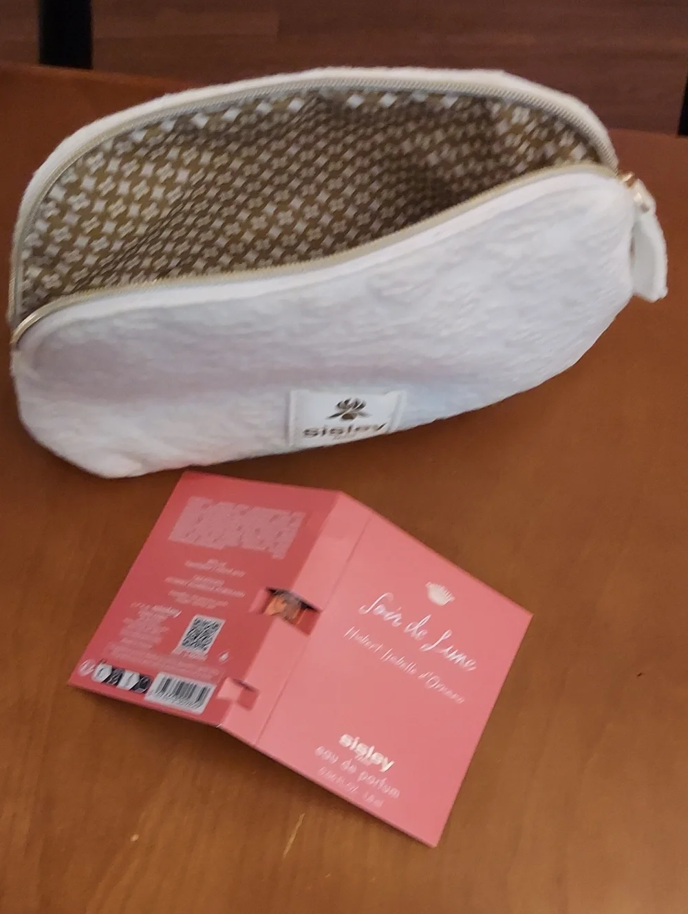 Sisley-Paris Cream Quilted Cosmetic Case with Gold Trim With Parfum Sample